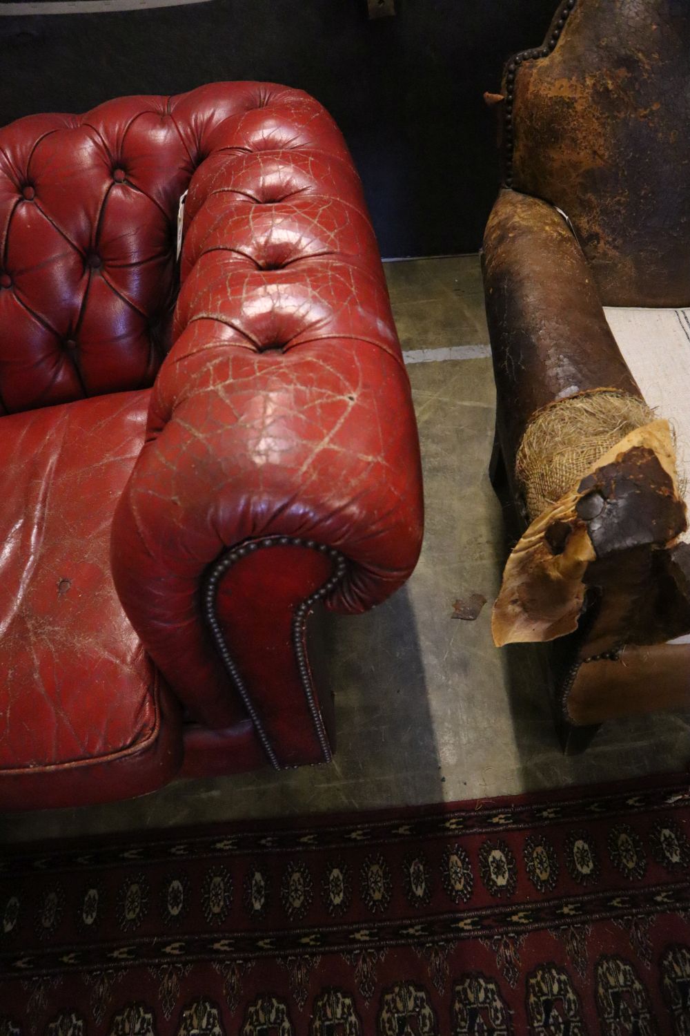 A buttoned red leather Chesterfield settee, width 194cm, depth 82cm, height 72cm